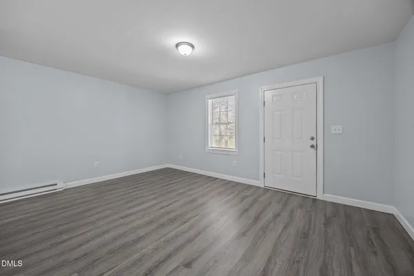 a kitchen with sink cabinets and wooden floor