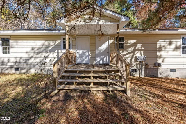 a view of a yard with table and chairs