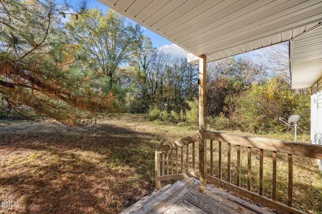 a view of yard with patio