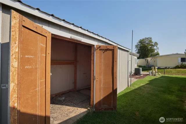 an aerial view of residential house with outdoor space and lake view