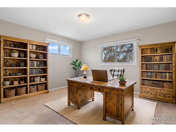 a workspace with furniture and bookshelf