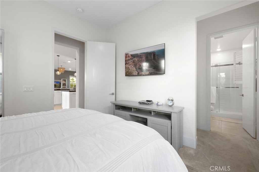 70 Ray Irvine, CA 92618 - Photo 16 of 41 a bedroom with a bed and a flat screen tv