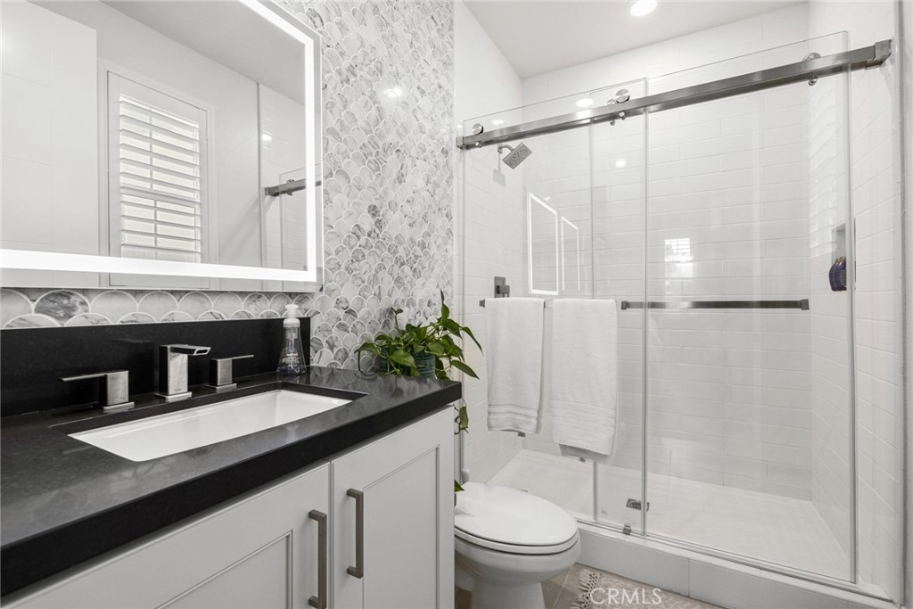 70 Ray Irvine, CA 92618 - Photo 17 of 41 a bathroom with a granite countertop sink toilet and shower
