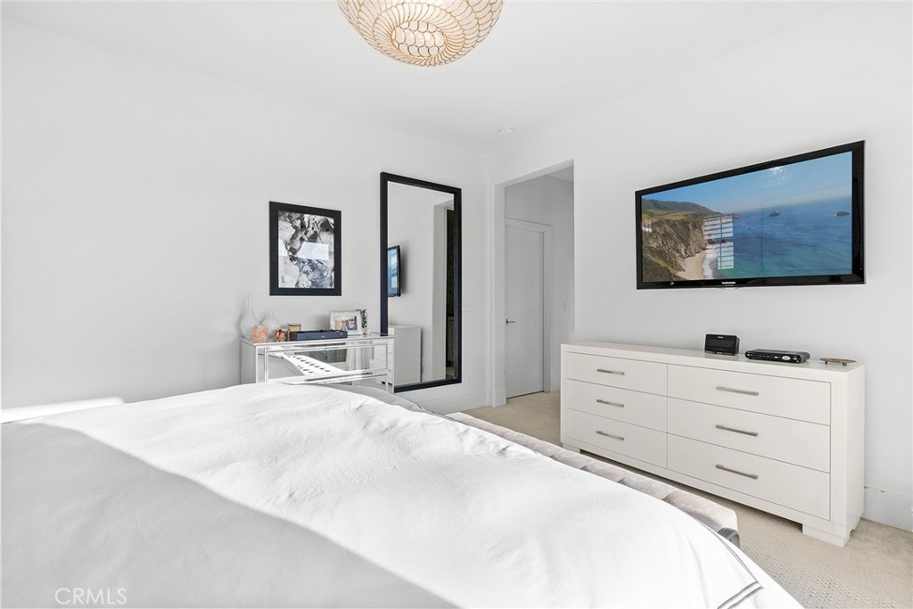 70 Ray Irvine, CA 92618 - Photo 28 of 41 a bedroom with a bed and a flat screen tv