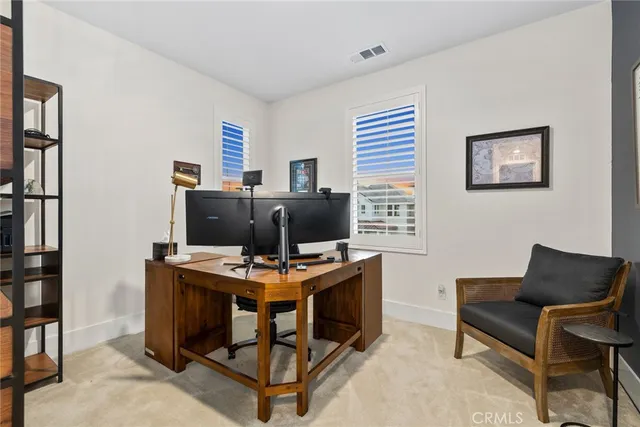 a kitchen with granite countertop white cabinets and sink