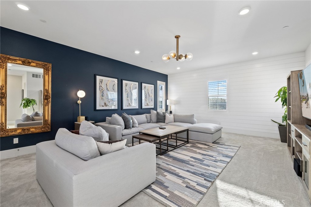 70 Ray Irvine, CA 92618 - Photo 33 of 41 a living room with furniture and a chandelier
