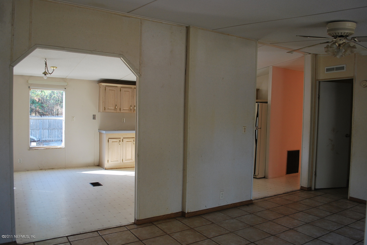 1530 Chaffee Road South Jacksonville, FL 32221 - Photo 4 of 24 Living room to family room