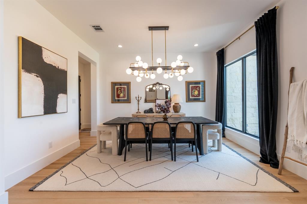 2396 County Road 2145 Cooper, TX 75432 - Photo 7 of 40 a view of a dining room with furniture and chandelier
