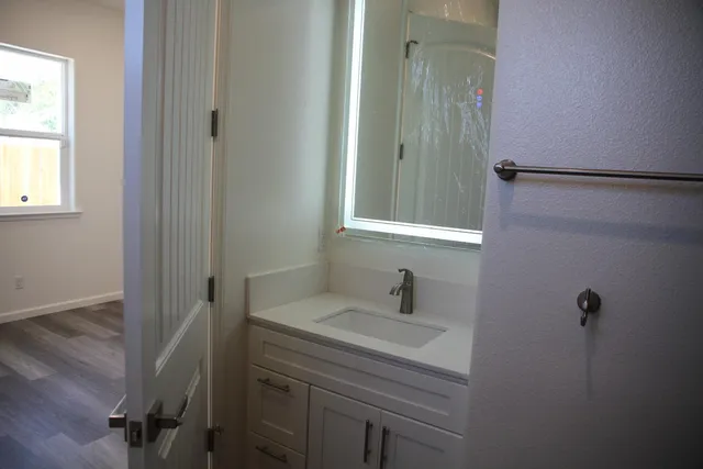 a kitchen with a sink and cabinets