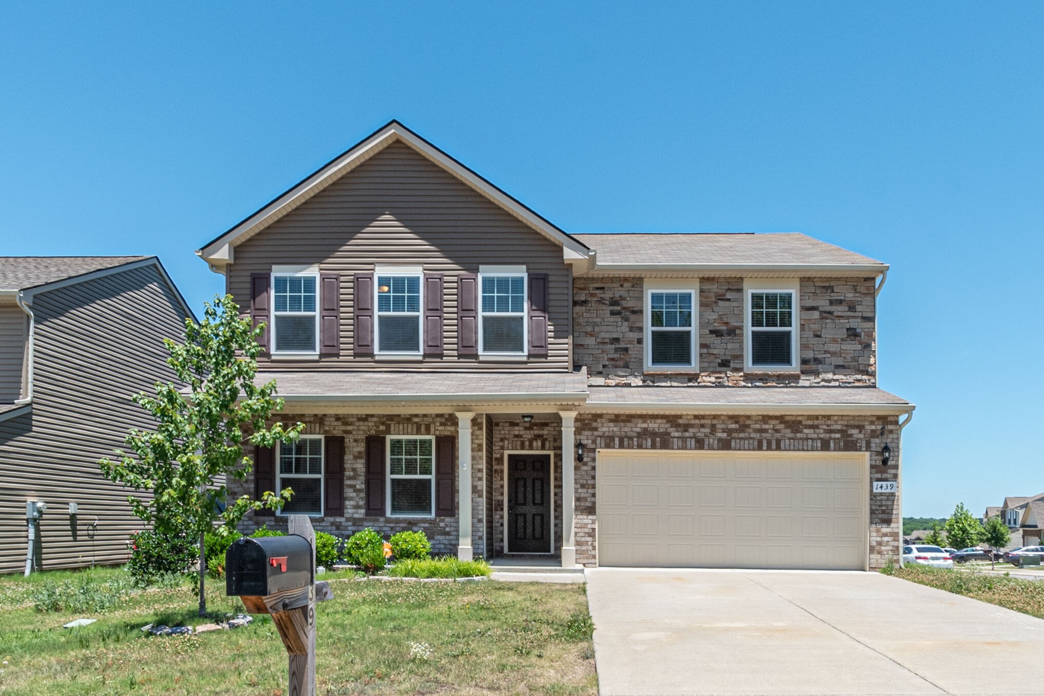 1439 Old Stone Road Lebanon, TN 37087 - Photo 1 of 39 a front view of a house with a yard and garage