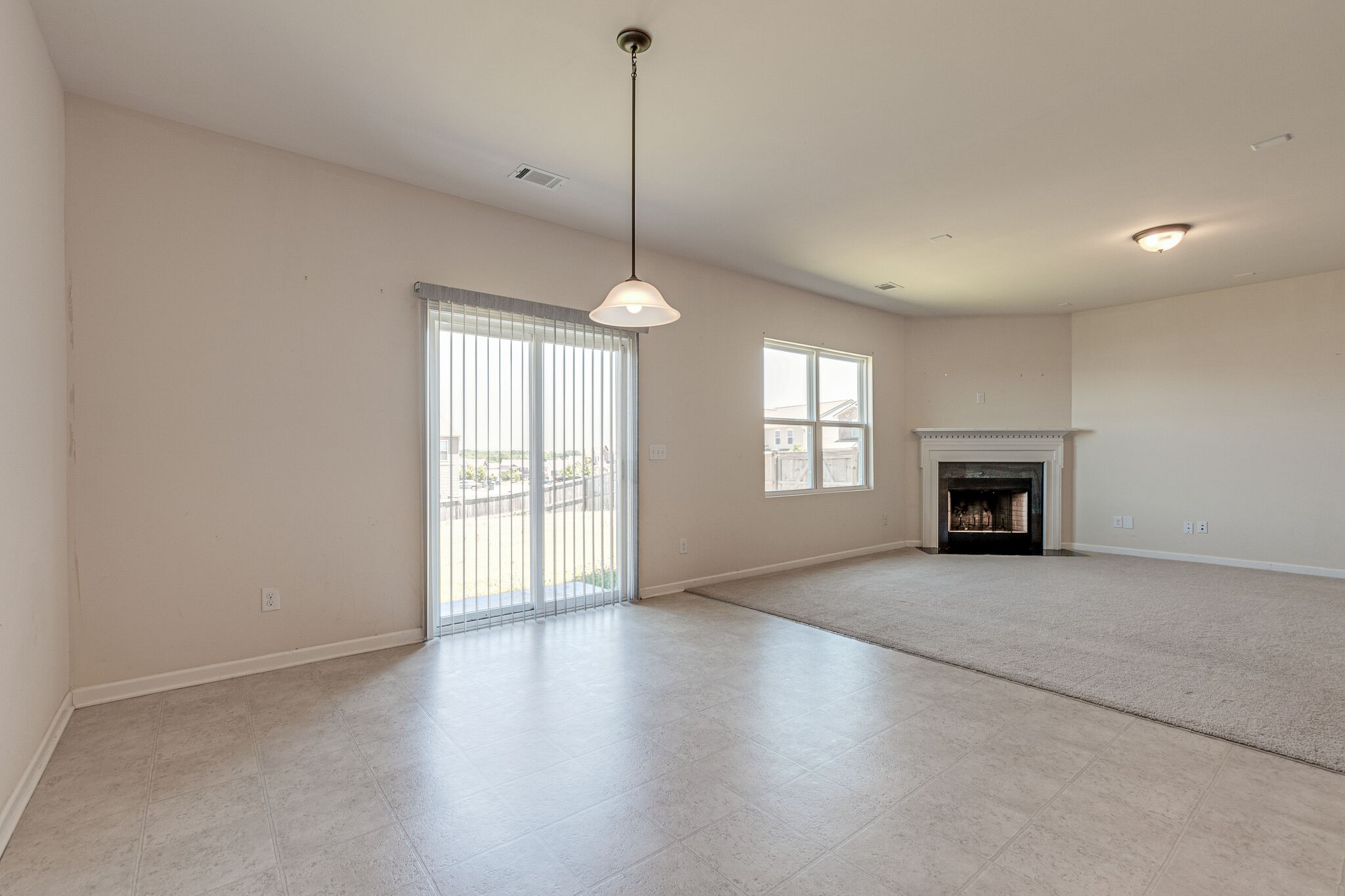 1439 Old Stone Road Lebanon, TN 37087 - Photo 13 of 39 a view of an empty room with a window and fireplace