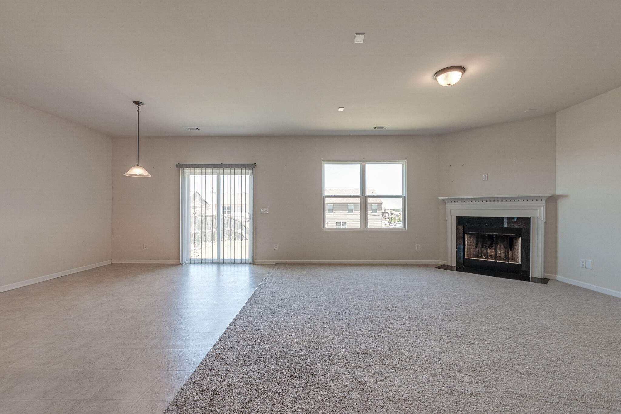 1439 Old Stone Road Lebanon, TN 37087 - Photo 15 of 39 an empty room with windows and fireplace