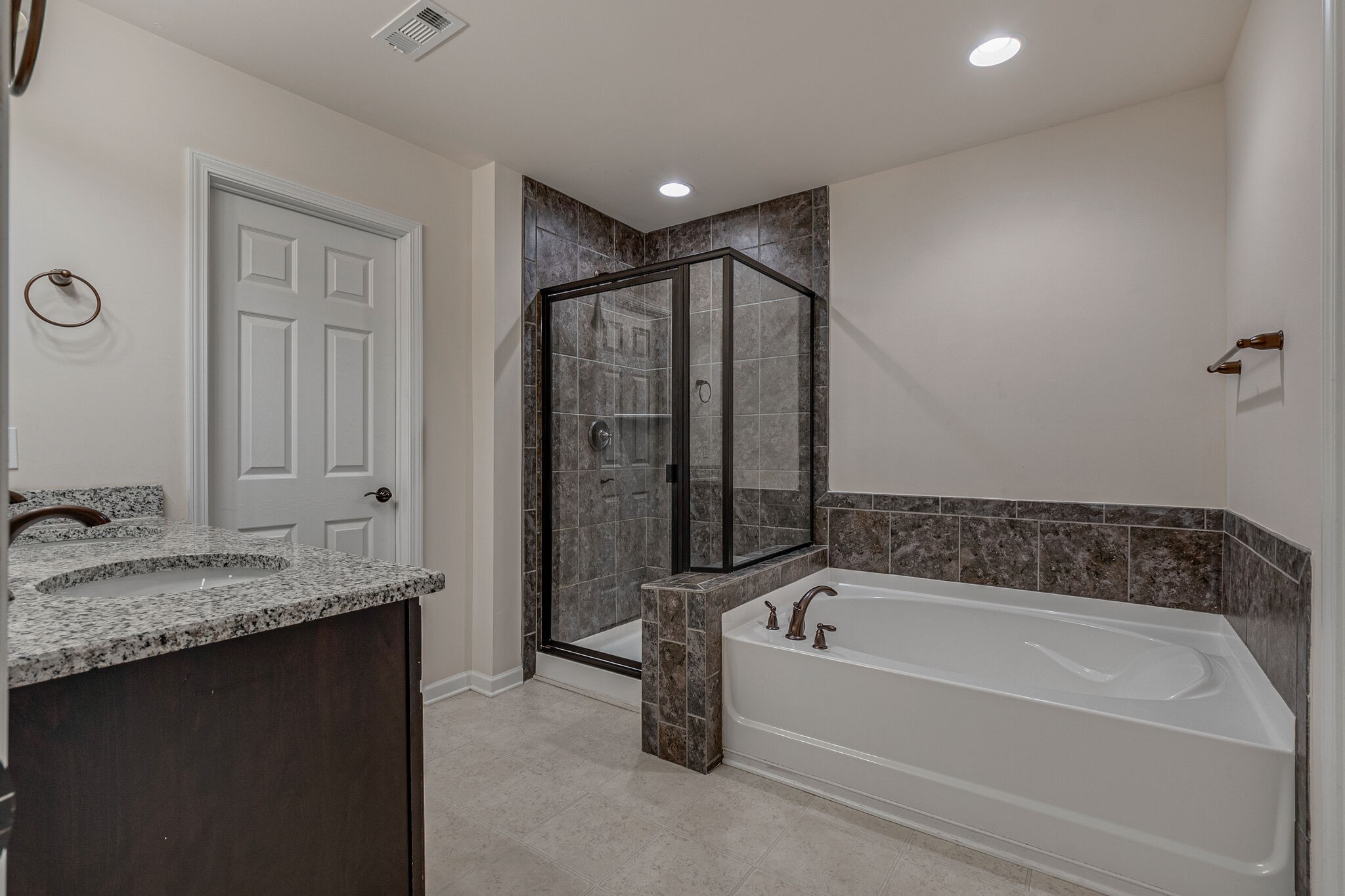 1439 Old Stone Road Lebanon, TN 37087 - Photo 26 of 39 a spacious bathroom with a granite countertop tub sink and mirror