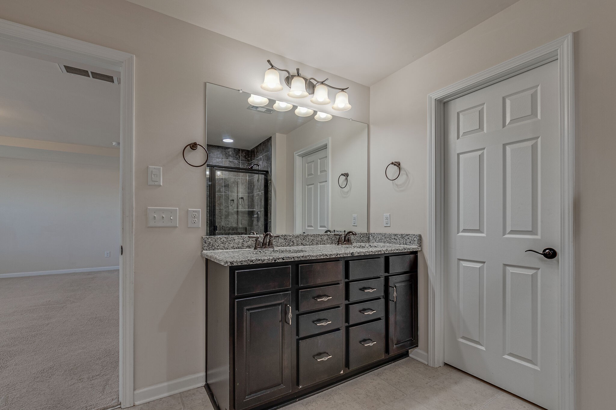 1439 Old Stone Road Lebanon, TN 37087 - Photo 27 of 39 a spacious bathroom with a granite countertop sink a mirror and a shower