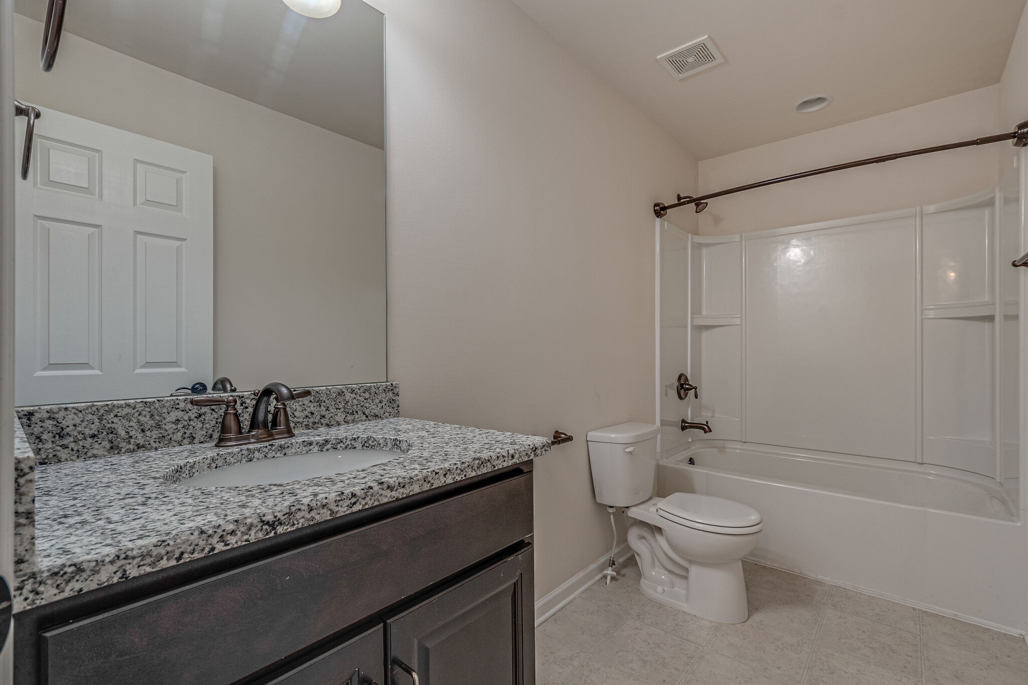 1439 Old Stone Road Lebanon, TN 37087 - Photo 31 of 39 a bathroom with a granite countertop sink a toilet and shower
