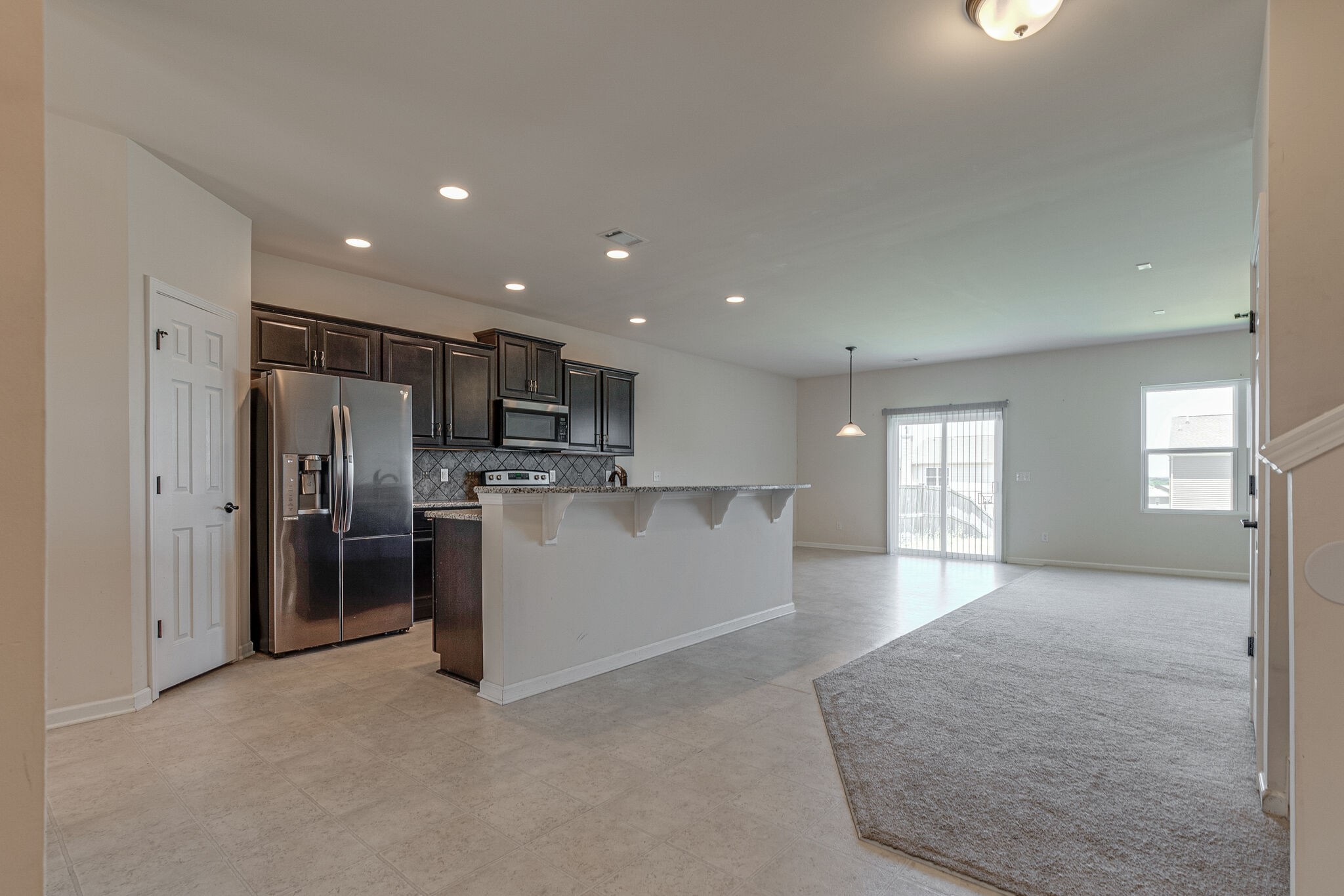 1439 Old Stone Road Lebanon, TN 37087 - Photo 6 of 39 a view of a kitchen with refrigerator and windows