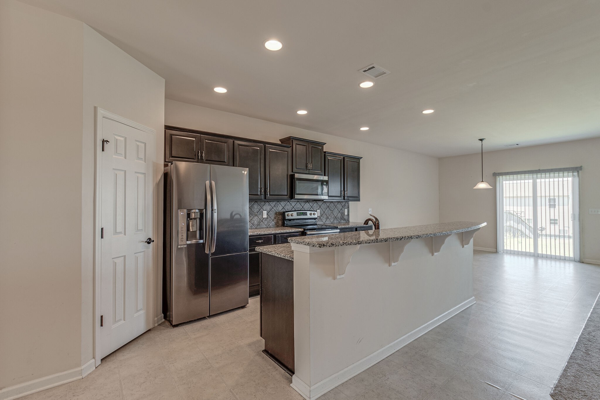 1439 Old Stone Road Lebanon, TN 37087 - Photo 7 of 39 a kitchen with stainless steel appliances granite countertop a refrigerator and a stove top oven