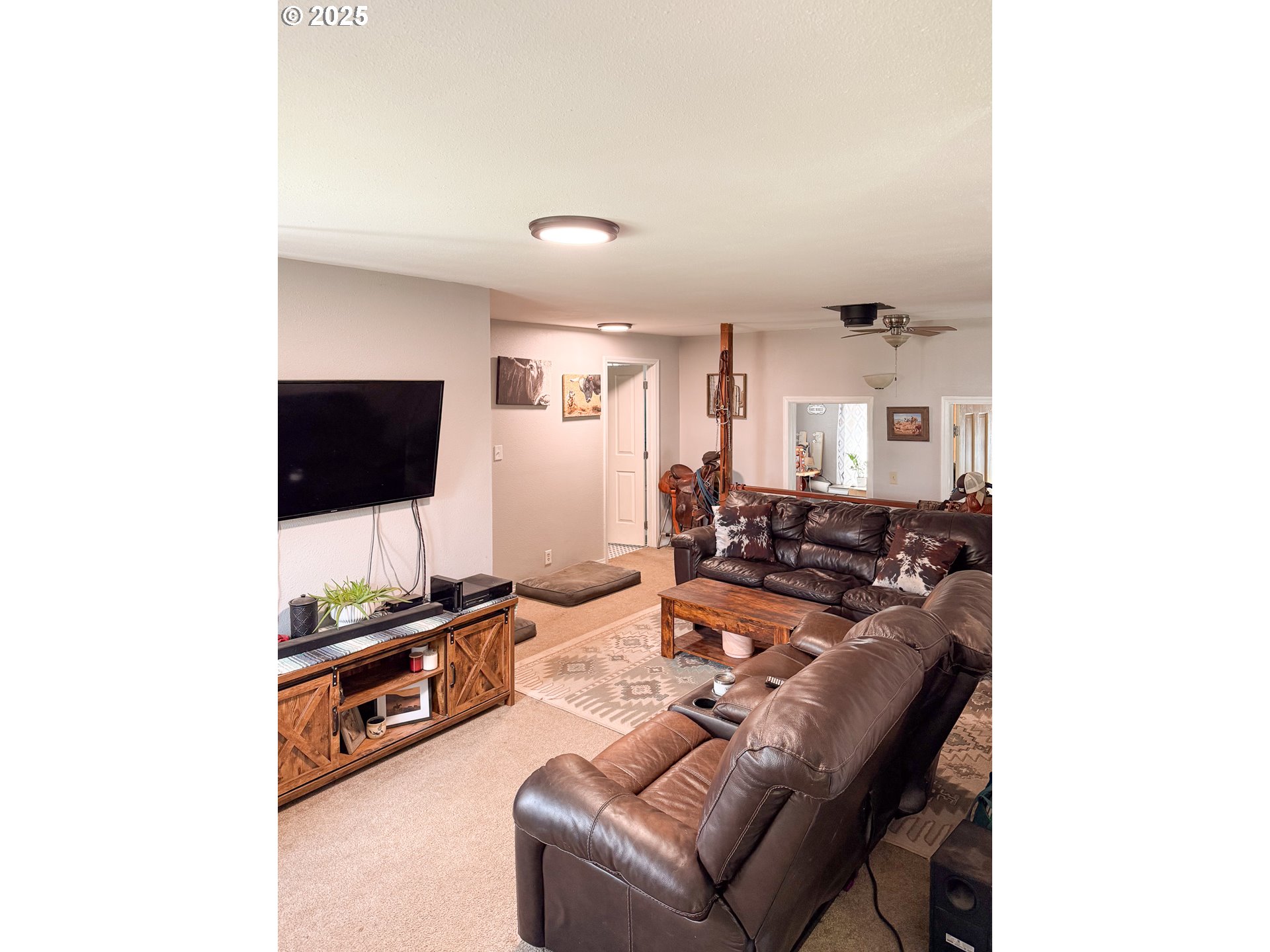 1960 Birch Street Elgin, OR 97827 - Photo 2 of 19 a living room with furniture and a flat screen tv