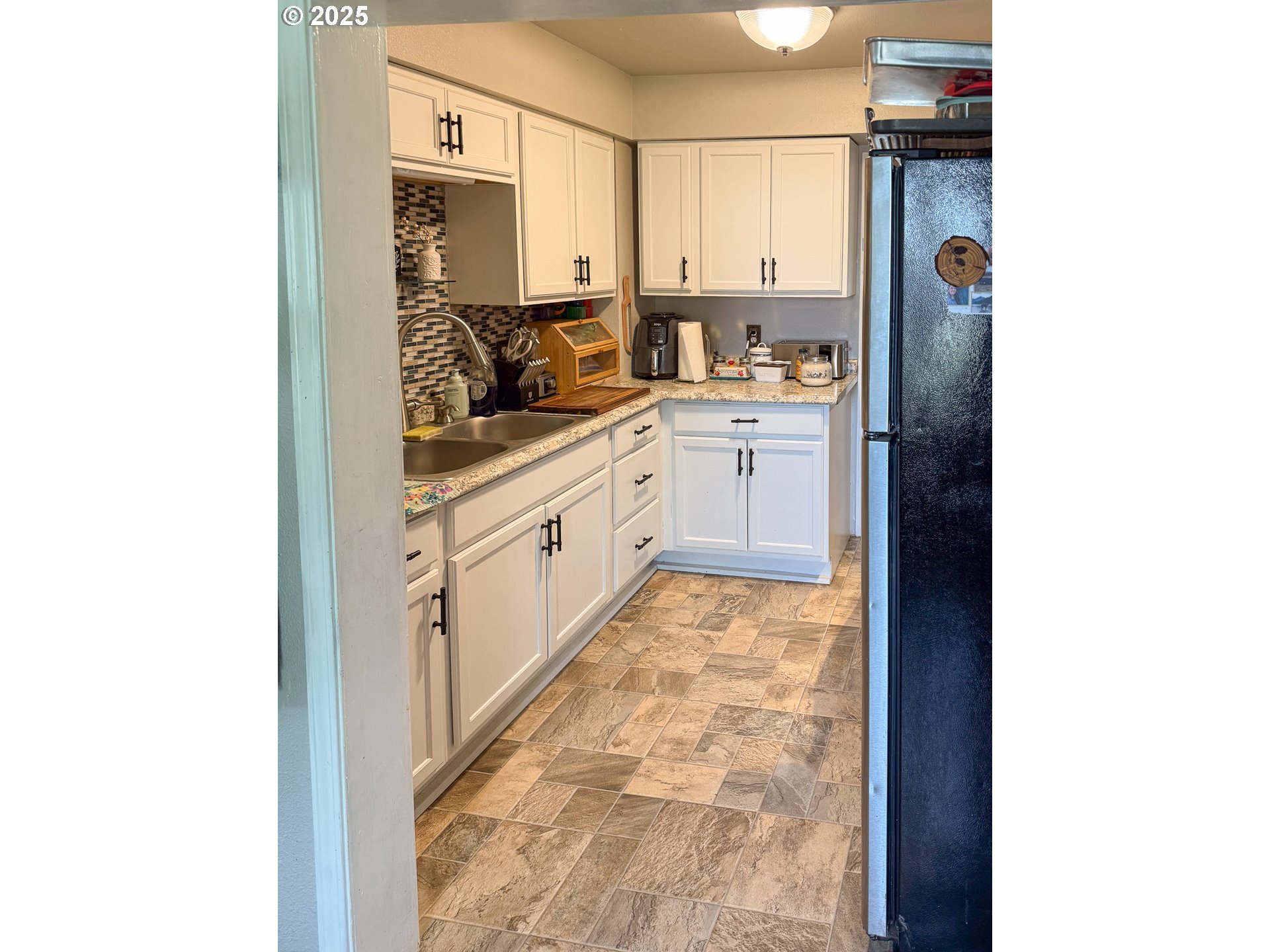 1960 Birch Street Elgin, OR 97827 - Photo 4 of 19 a kitchen with a sink and cabinets