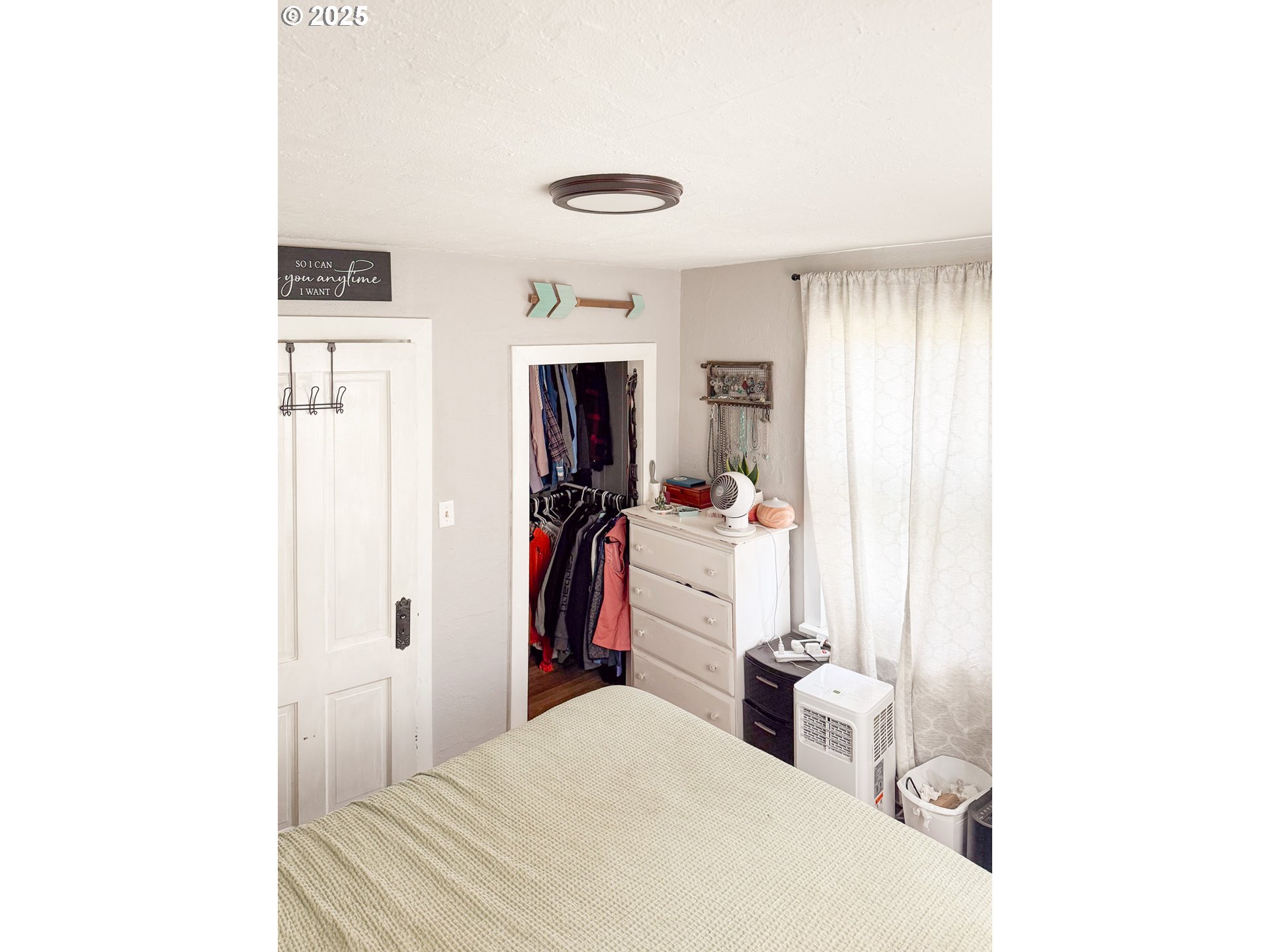 1960 Birch Street Elgin, OR 97827 - Photo 7 of 19 a bedroom with a bed and a mirror