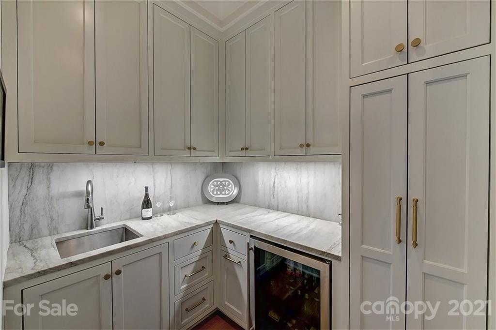 3452 Foxcroft Road Charlotte, NC 28211 - Photo 13 of 48 a kitchen with a sink and cabinets