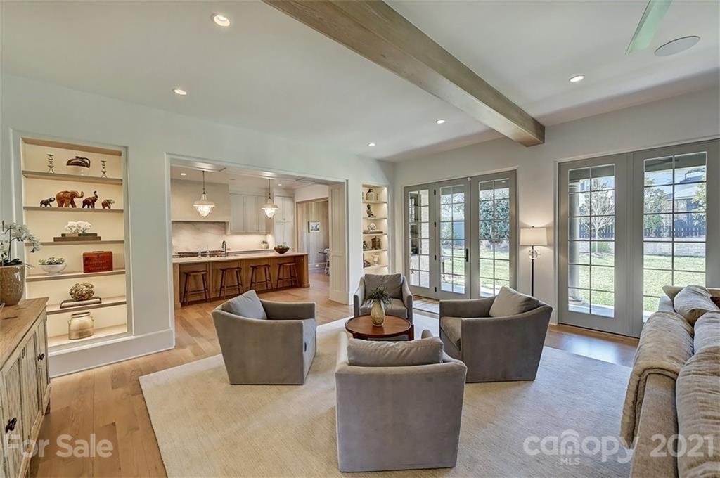 3452 Foxcroft Road Charlotte, NC 28211 - Photo 14 of 48 a living room with furniture and large windows