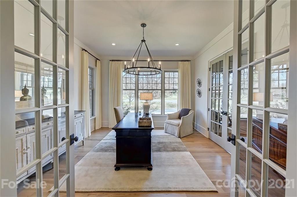 3452 Foxcroft Road Charlotte, NC 28211 - Photo 17 of 48 a living room with furniture large windows