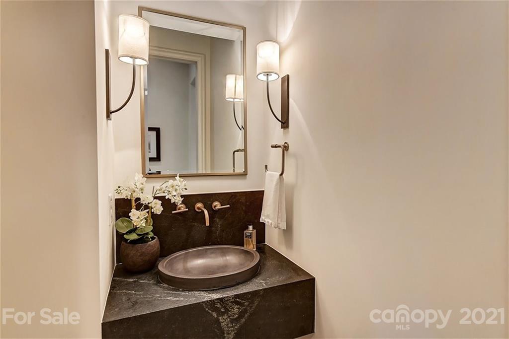 3452 Foxcroft Road Charlotte, NC 28211 - Photo 22 of 48 a bathroom with a granite countertop sink and a mirror