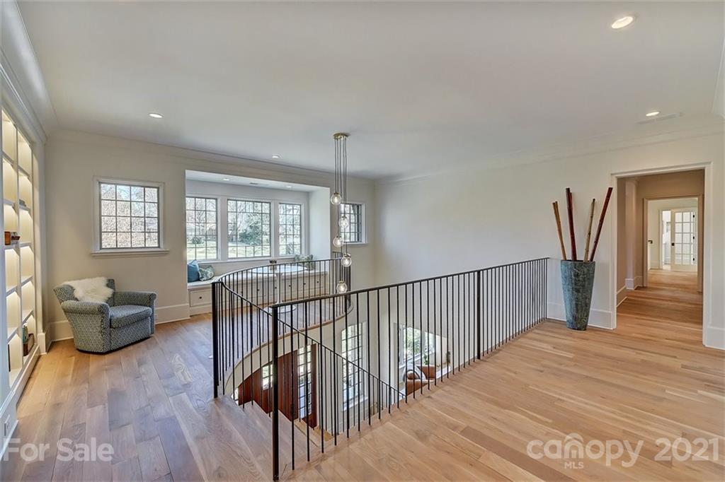 3452 Foxcroft Road Charlotte, NC 28211 - Photo 28 of 48 a bedroom with furniture window and wooden floor