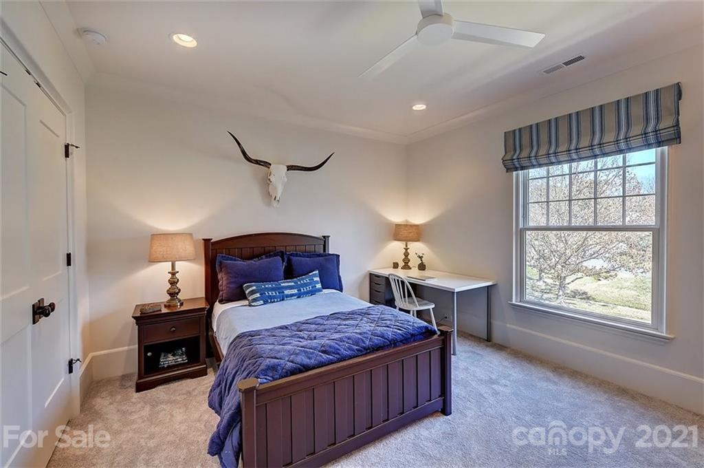 3452 Foxcroft Road Charlotte, NC 28211 - Photo 31 of 48 a bedroom with a large bed and a window