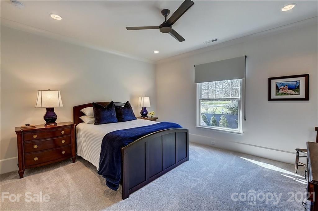 3452 Foxcroft Road Charlotte, NC 28211 - Photo 34 of 48 a bedroom with a bed and a window