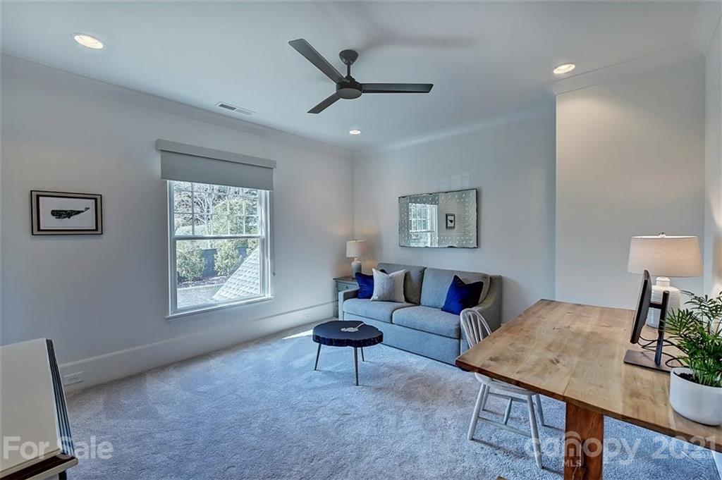 3452 Foxcroft Road Charlotte, NC 28211 - Photo 37 of 48 a living room with furniture and a window
