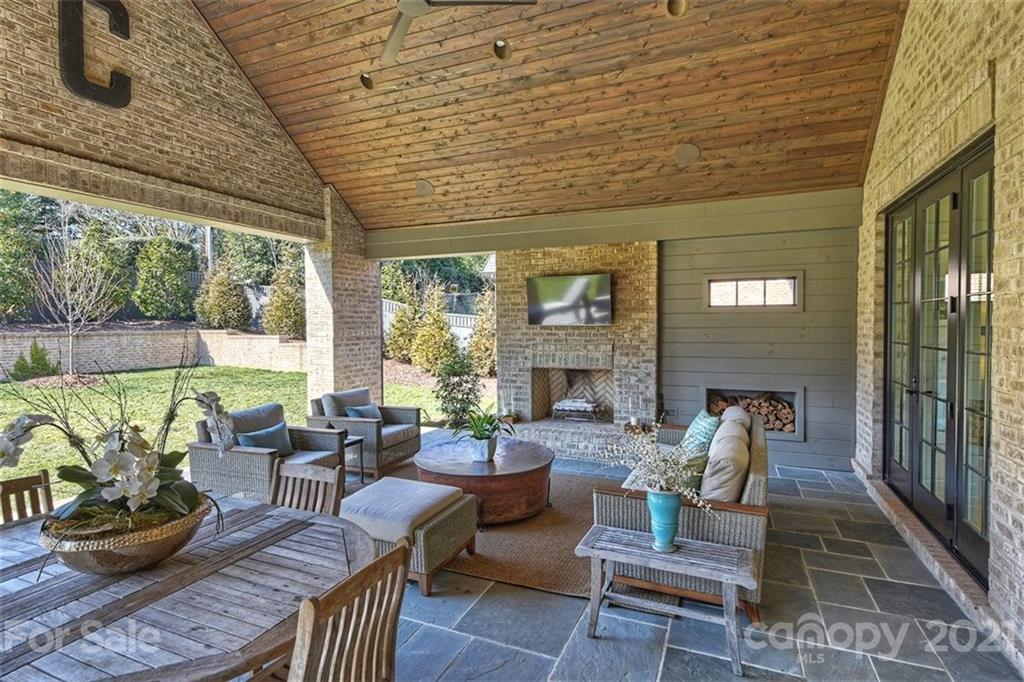 3452 Foxcroft Road Charlotte, NC 28211 - Photo 42 of 48 a outdoor living space with patio furniture and a fireplace