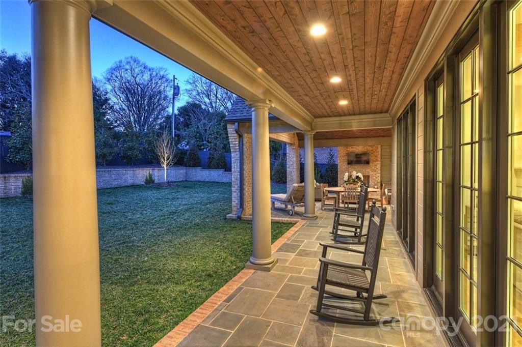 3452 Foxcroft Road Charlotte, NC 28211 - Photo 44 of 48 a view of a porch with chairs and backyard