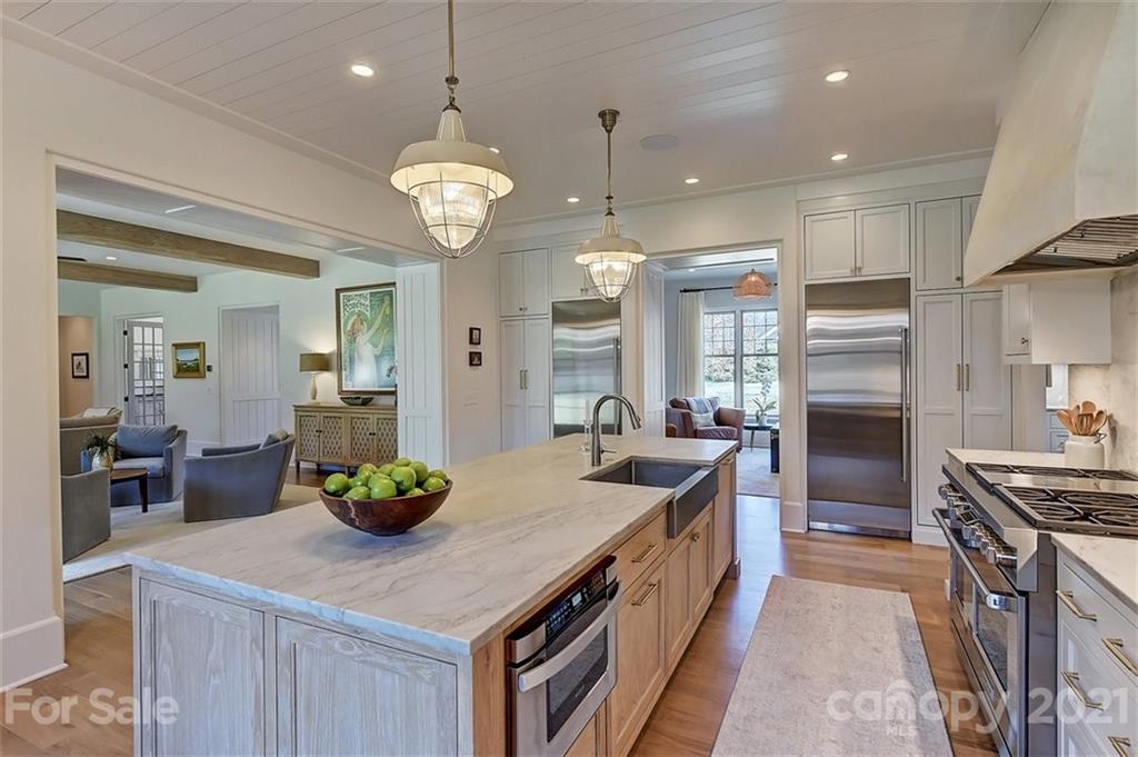 3452 Foxcroft Road Charlotte, NC 28211 - Photo 10 of 48 a kitchen with a sink stove and refrigerator