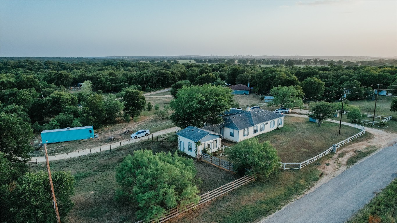 an aerial view of a house with a garden