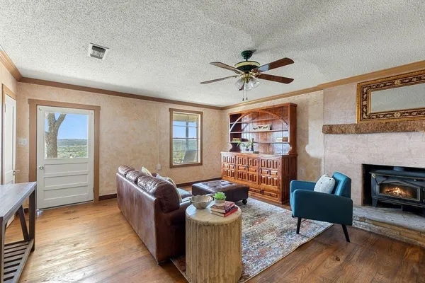 a living room with furniture and a fireplace