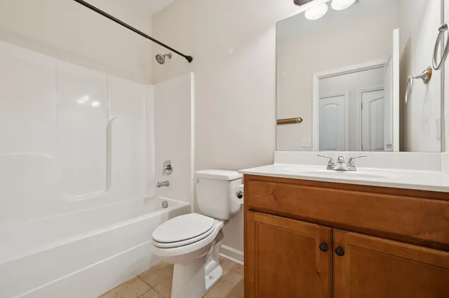 a bathroom with a sink a toilet and a bathtub