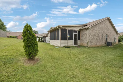 a view of a house with a garden