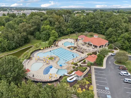 an aerial view of a house with outdoor space