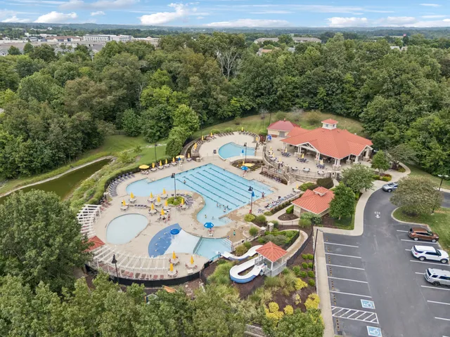 an aerial view of a house with outdoor space