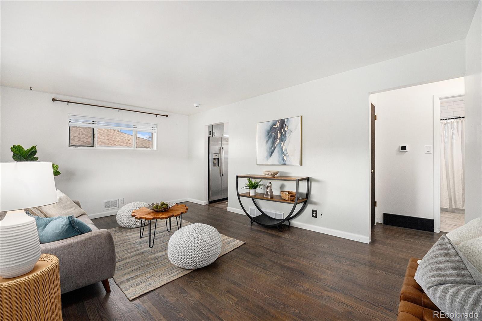 7625 Turner Drive Denver, CO 80221 - Photo 12 of 26 a living room with furniture and wooden floor