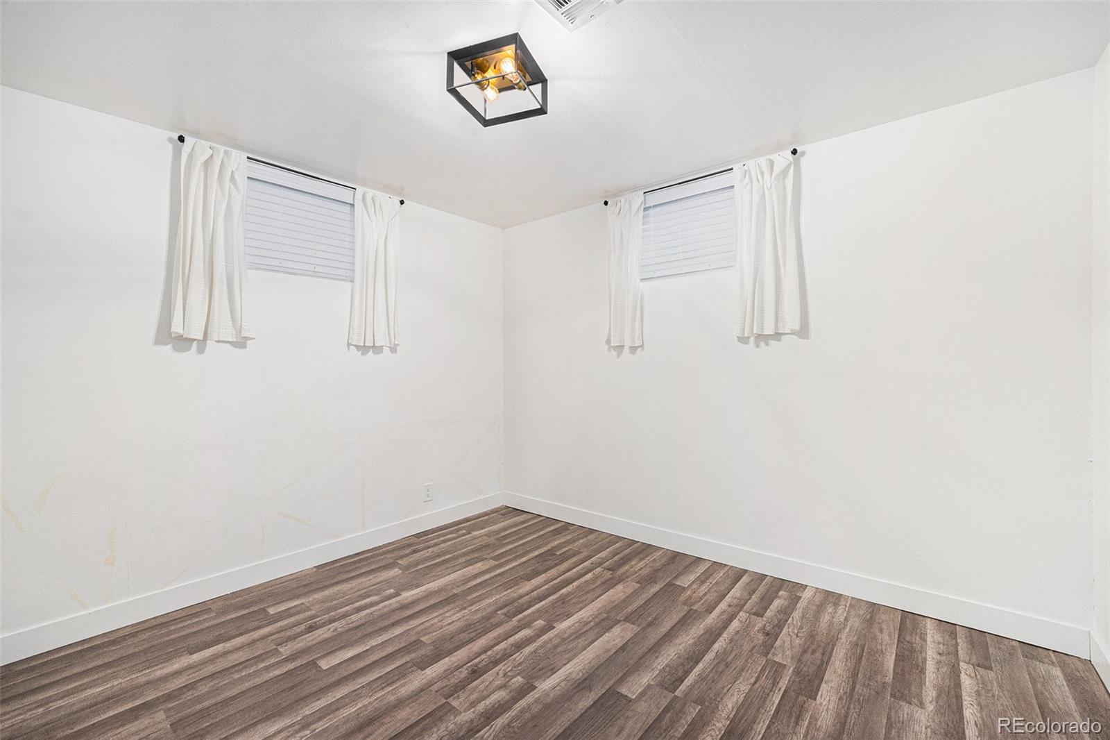 7625 Turner Drive Denver, CO 80221 - Photo 14 of 26 a view of a room with wooden floor