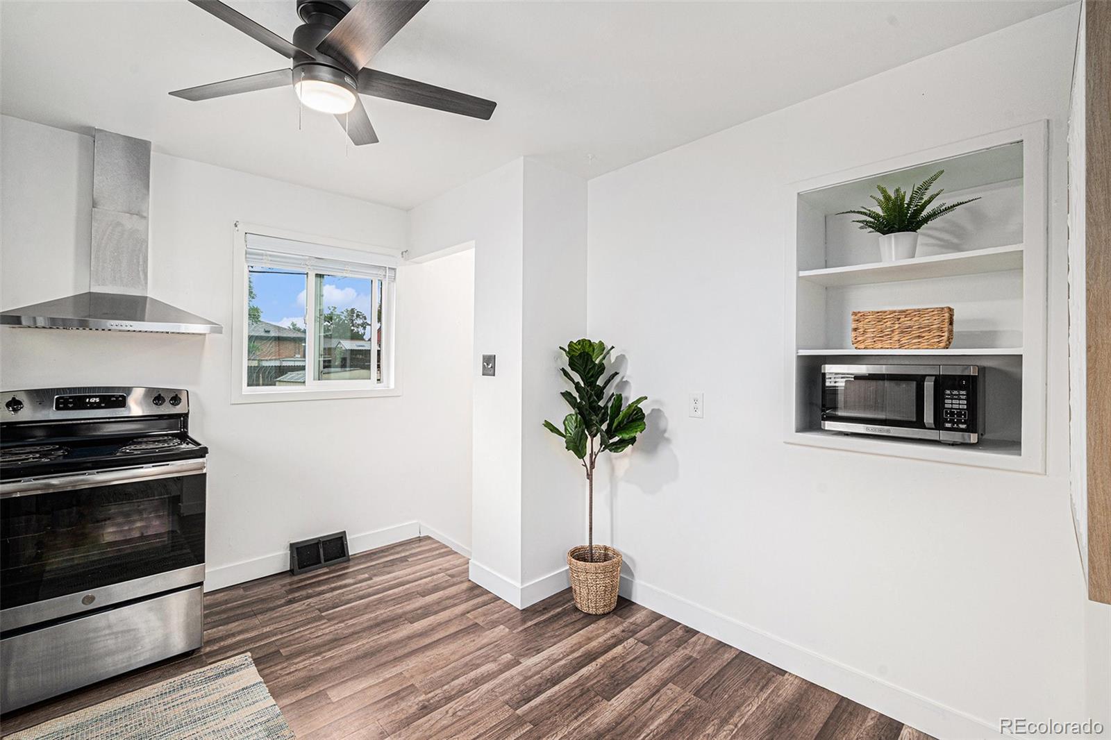 7625 Turner Drive Denver, CO 80221 - Photo 2 of 26 a view of a bedroom with furniture and ceiling fan