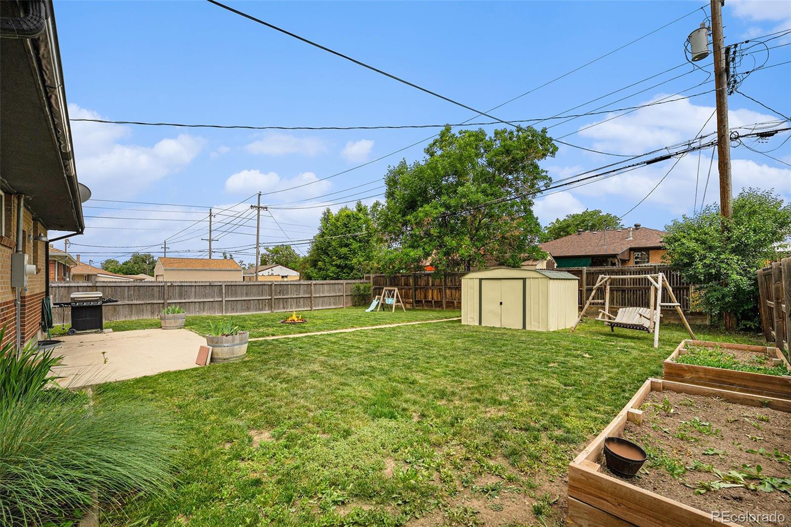 7625 Turner Drive Denver, CO 80221 - Photo 21 of 26 a view of a house with a yard