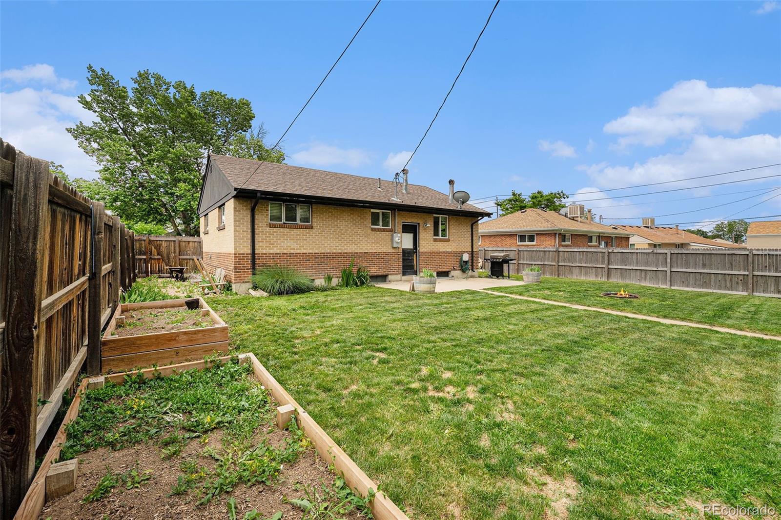 7625 Turner Drive Denver, CO 80221 - Photo 23 of 26 a front view of a house with garden
