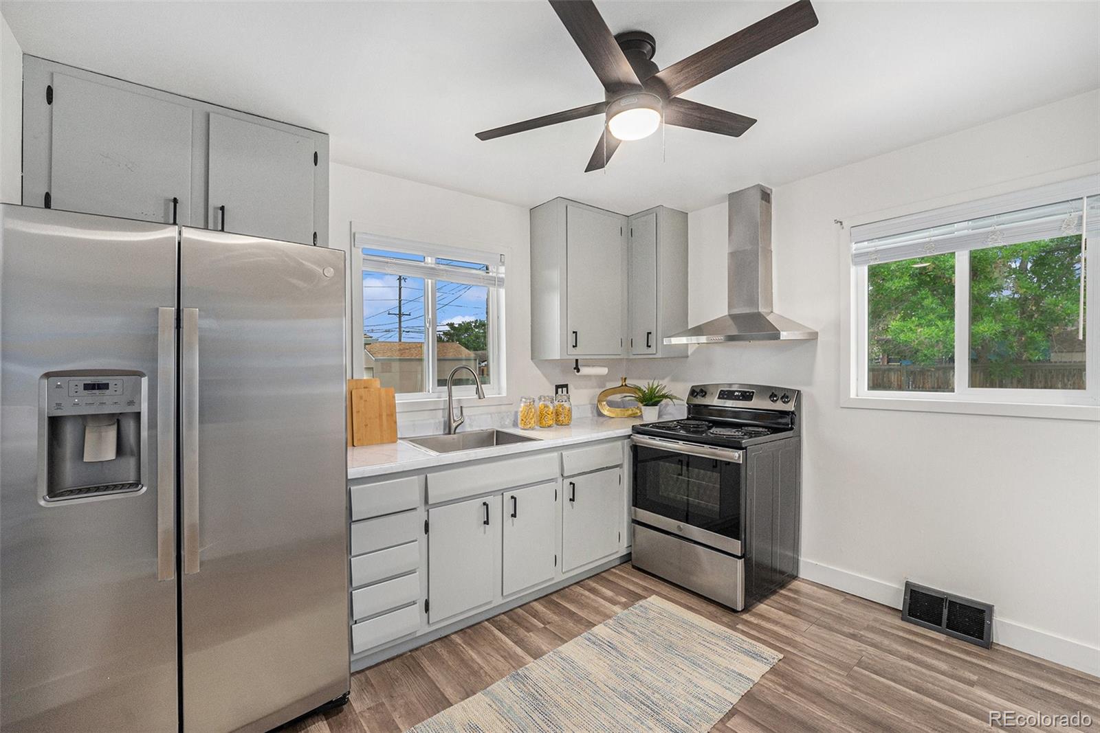 7625 Turner Drive Denver, CO 80221 - Photo 4 of 26 a kitchen with stainless steel appliances granite countertop a refrigerator a sink a stove and a refrigerator