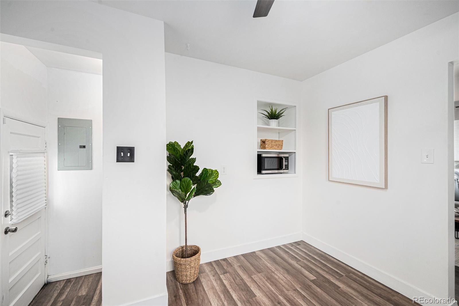 7625 Turner Drive Denver, CO 80221 - Photo 6 of 26 a room with furniture and a potted plant