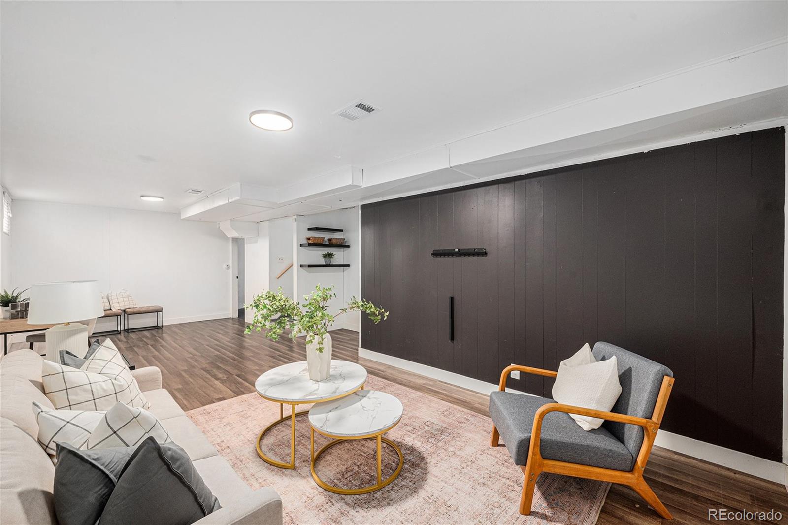 7625 Turner Drive Denver, CO 80221 - Photo 9 of 26 a living room with furniture and a potted plant