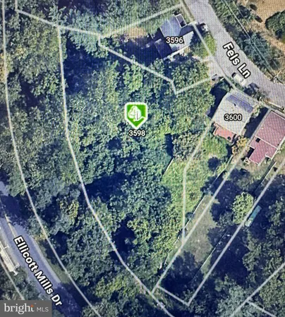 an aerial view of a residential houses with outdoor space